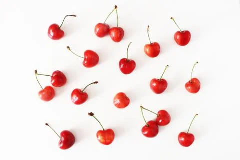 Summer fruit pattern. Healthy fresh red cherries isolated on white table Fotos de archivo