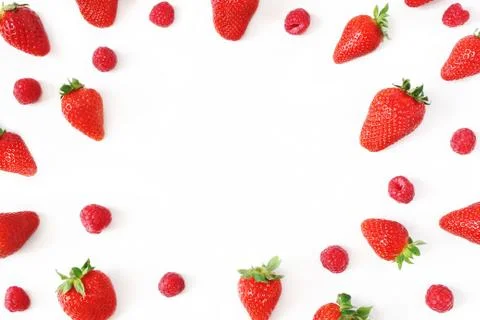 Summer fruit pattern. Healthy fresh red strawberries and raspberries, isolated Stock Photos