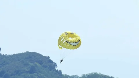 Summer Fun at the Sea - Parachuting Stock Footage 80475691