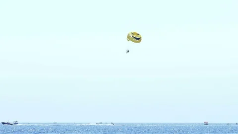 Summer Fun at the Sea - Parachuting Stock Footage 80475752