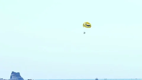 Summer Fun at the Sea - Parachuting Stock Footage 80475823