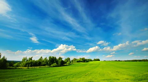 Summer green field landscape with clouds running across the sky, time-lapse. 库存影片 27229751