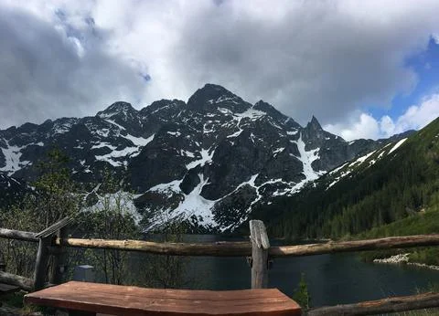 Summer hiking path views of mountains, forest, trees and lake nature landscape. Stock Photos