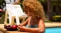 Summer Holiday and Technology Concept. Girl Using Smart Phone and Laughing in HD Footage