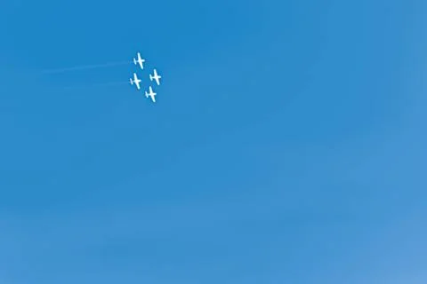 Summer holiday background with clear blue skies and white airplanes with smok Stock Illustration
