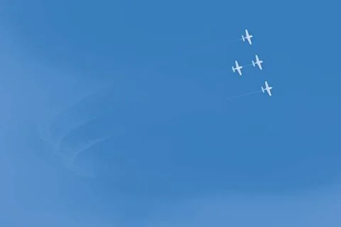 Summer holiday background with clear blue skies and white airplanes with smok Stock Illustration