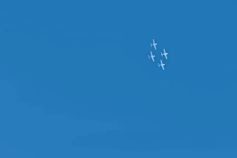 Summer holiday background with clear blue skies and white airplanes with smok Stock Illustration