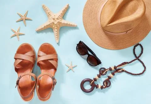 Summer holiday background, flat lay beach women's accessories: straw hat Stock Photos