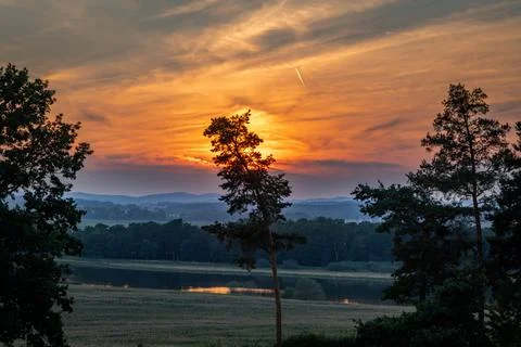 Summer hot sunset cloudy Dehtar pond in south Bohemia Stock Photos