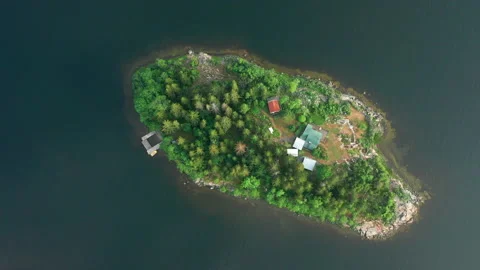 Summer house in lake on tiny remote island between trees. Stock Footage 159160818