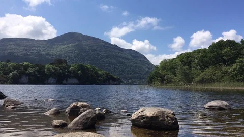 Summer At Lake Low Angle, Rocks Foreground, Mountain Backdrop, Killarney Stock Footage 90818684
