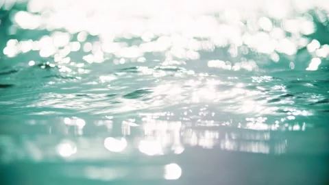 Summer lake surface with light spots and ripples; shimmering, sparkling Stock Footage 345592804