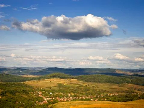 Summer landscape with cloud above small village Stock Photos