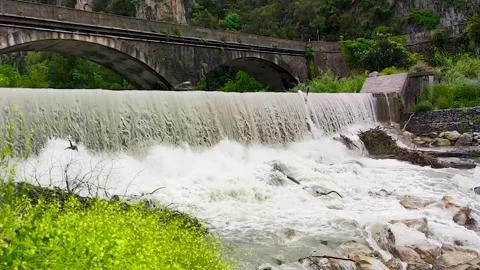Summer Landscape with a Dam, a River and an Old Bridge in Calabria. Stock Footage 243188348