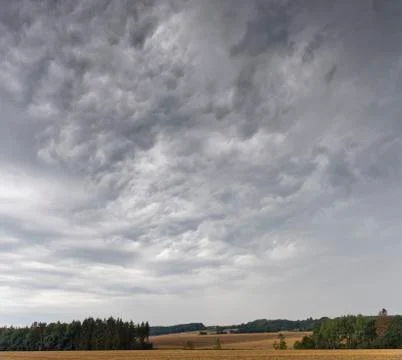 Summer landscape with dramatic cloudy sky Stock Photos