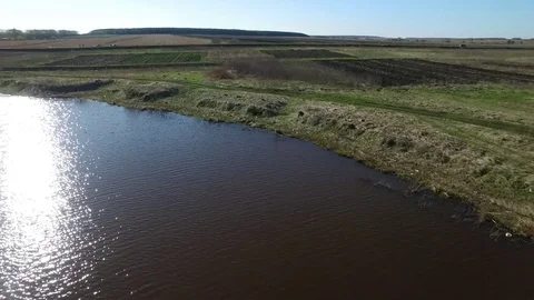 Summer Landscape. Footage. Panoramic landscape view and clear blue sky. A lake Stock Footage