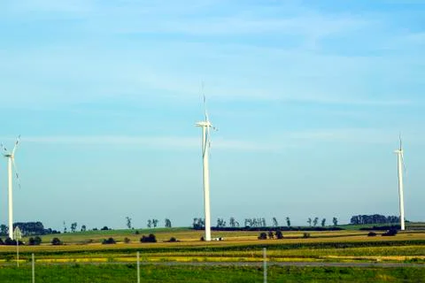 Summer landscape with new Windmills in fields Stock Photos