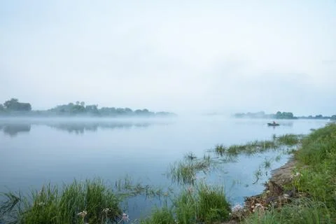 Summer landscape, river, fog, in the morning, with a beautiful sky Stock Photos
