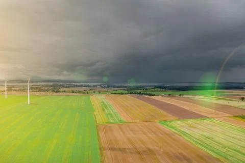 Summer landscape with a thundercloud over fields and forests, view from above Stock Photos