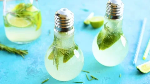 Summer lemonade with lime and herbs in lamp glasses Video stock 92262676