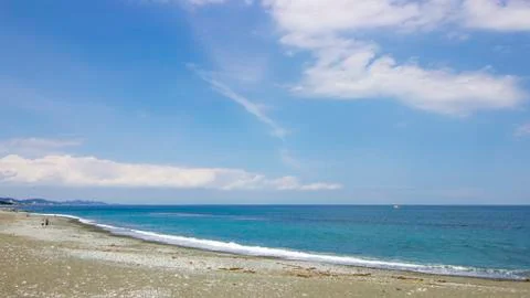 Summer light bluesky on beach with deep blue sea Stock Photos
