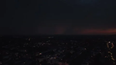 Summer lightning striking city during night thunderstorm. Nice aerial view drone Stock Footage 344586683