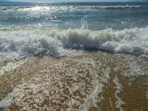 Summer mood. Waves on the beach. Stock Photos