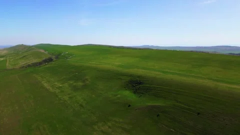 Summer mountain landscape with green fields and hills, taken from a height Stock Footage 278613264