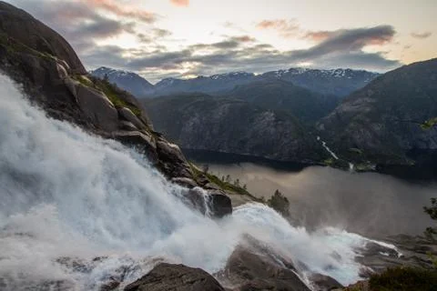 Summer mountain Langfossen waterfall on slope Etne, Norway. Stock Photos