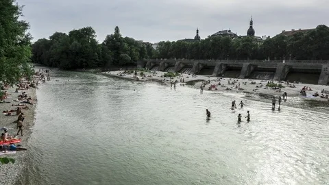 Summer in Munich, Isar River people swimming. Timelapse Stock Footage 77212879