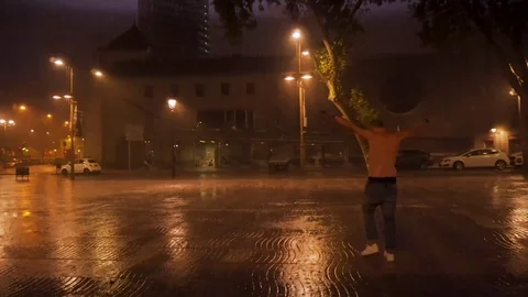 Summer night La Ramble man walking into the pouring rain with lightning Stock Footage 124205451