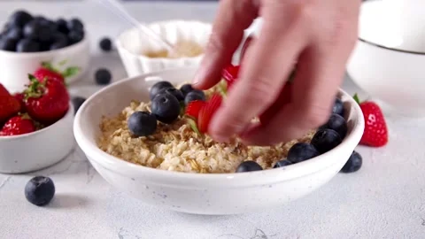 Summer oatmeal with berry Video stock 197378585