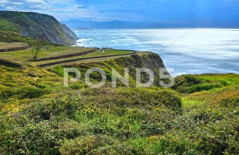 Summer ocean coastline view in Barrika town (Spain). Stock Photos