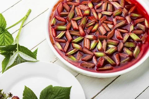 Summer open pie with rhubarb and raspberries. Stock Photos