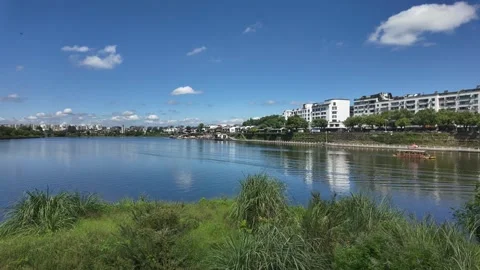 Summer panoramic view of blue sky and white clouds by the Xin'an River Видео 347426849
