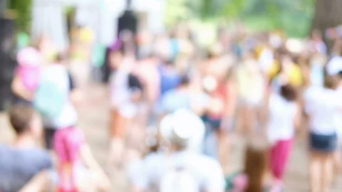Summer party outdoors. Blurred background with dancing people in colorful Stock Footage 114736236