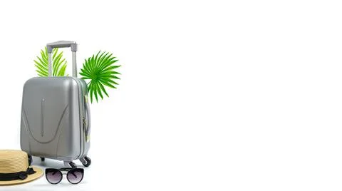 Summer pattern background. Suitcase, sunglasses with palm leaves and straw ha 스톡 사진