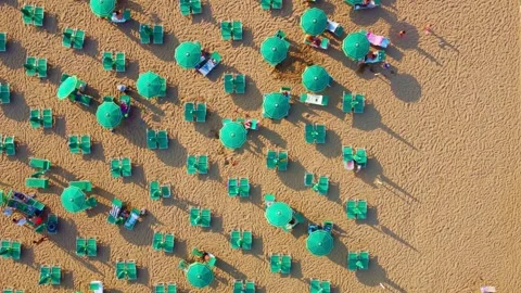 Summer pattern with beach umbrellas seen from a drone Stock Footage 279811852