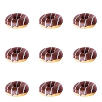 Summer pattern with chocolate donut on a light background. Stock Photos