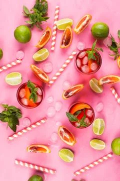 Summer pattern with citrus slices and red drink Stock Photos
