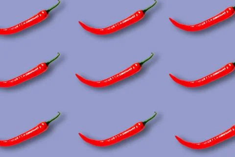 Summer pattern with red chili pepper on a lilac background Foto stock