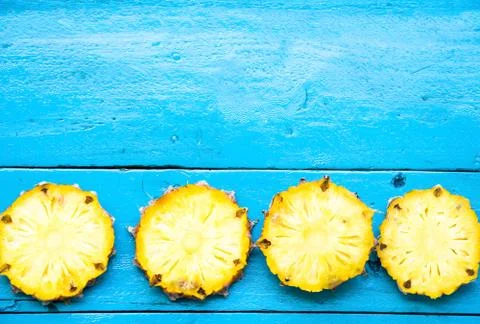 The summer pineapple is slice for eat on blue wooden background. copy space.. Stock Photos