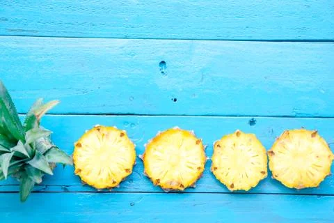 The summer pineapple is slice for eat on blue wooden background. copy space.. Stock Photos