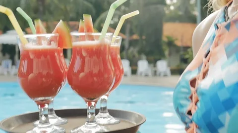 Summer pool party. Close up of fresh juice. Stock-Footage 88700473