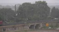 Summer Rain Storm Container Cargo Train Passing Aerial View Freight Shipping Day HD Footage