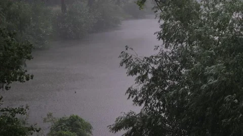 Summer rain with a thunderstorm over the river. P1012169 1 25s Stock Footage 199469242