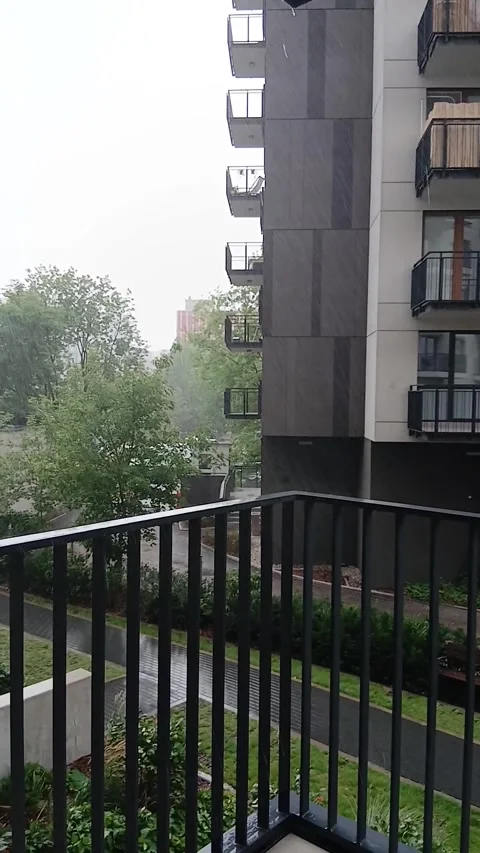 Summer rain view from a high floor apartment balcony Stock Footage 341757846