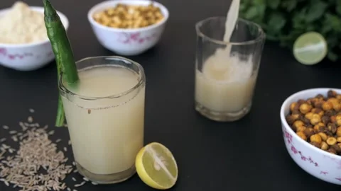 Summer refreshing drink Sattu being decorated with a sliced chili in a glass Stock-Footage 155824840