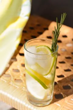 Summer refreshing lemonade drink on wicker bench Stock Photos