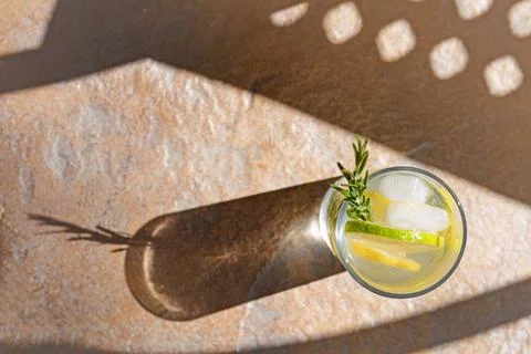 Summer refreshing lemonade on light brown table, top view. Space for text Stock Photos